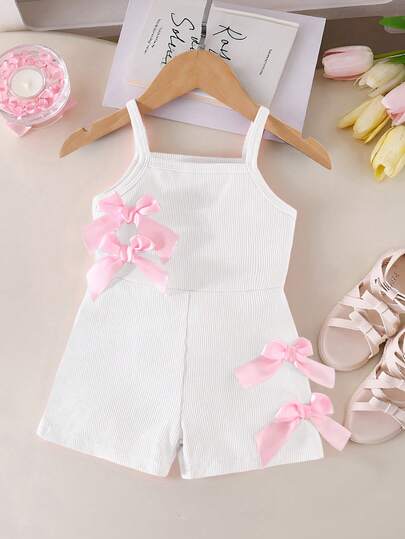 SHEIN Pelele casual sin mangas para bebé niña, de tela elástica acanalada con decoración de lazo, estilo corto, color rosa, para verano