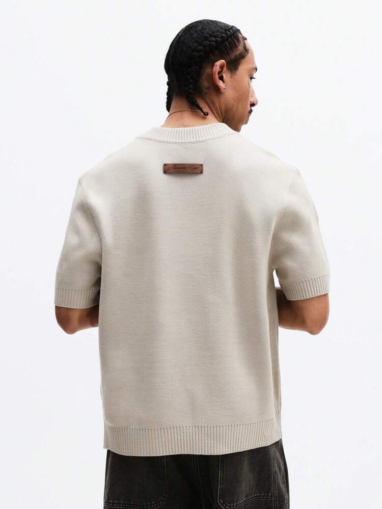 Maglietta rilassata in maglia con bordo a coste