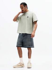 SUMWON Distressed Medium Wash Denim Shorts With Raw Hem Detail And Five Pocket Design For Casual Summer Style - Blue - View 4