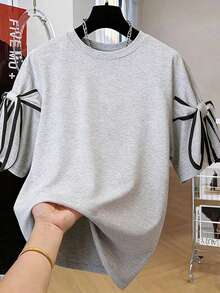 Calvaya 大码女式撞色条纹蝴蝶结装饰休闲T恤，适合日常通勤和休闲运动。 - 灰色 - 查看 1