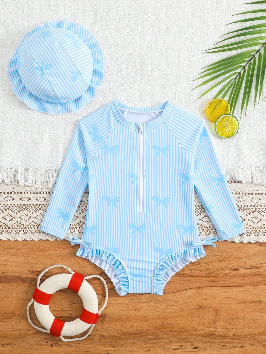1 bộ áo tắm liền thân dài tay cho bé gái, có khóa kéo, nơ xinh xắn và họa tiết hoa, kèm mũ. - Xanh và trắng - Xem 1