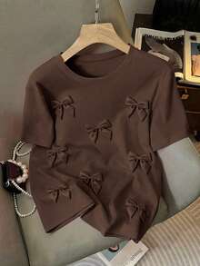EMERY ROSE Camiseta de mujer de cuello redondo casual con lazo 3D y manga corta, estilo de verano, talla grande - Marrón - Ver 1