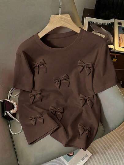 EMERY ROSE Camiseta de mujer de cuello redondo casual con lazo 3D y manga corta, estilo de verano, talla grande