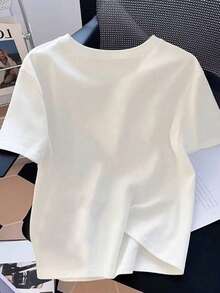 Resyla Áo thun nữ cổ tròn tay ngắn đính đá giả hình trái tim rỗng - trắng - Xem 2