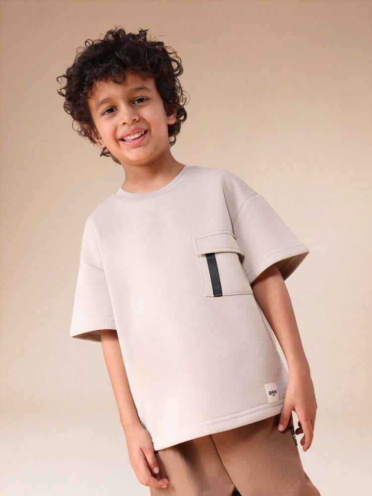 Maglietta oversize con tasca sul petto
