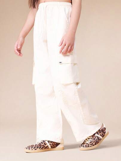  SUMWON 宽松工装裤，多口袋设计，抽绳腰带，日常穿着舒适实用，休闲度假风。