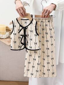 SHEIN 女童两件套蝴蝶结印花无袖上衣+A字裙套装，可爱优雅，适合返校季和春夏穿着