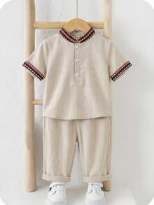 SHEIN Bộ 2 món cho bé trai mùa hè, kiểu dáng truyền thống cổ điển: áo sơ mi cổ tàu và quần ống rộng, thích hợp cho tiệc sinh nhật, tiệc tưng bừng, sự kiện buổi tối, biểu diễn, đám cưới, tiệc mừng em bé chào đời, lễ rửa tội và lễ kỷ niệm sinh nhật lần thứ nhất. - Nhiều màu - Xem 6