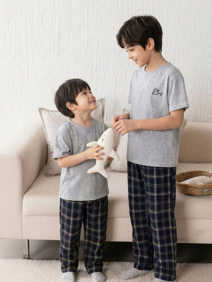 SHEIN 2pcs Tween Boy Casual Letter Embroidered Round Neck Short Sleeve T-Shirt And Plaid Pattern Loose Fit Pajama Pants Set - Grey - View 1