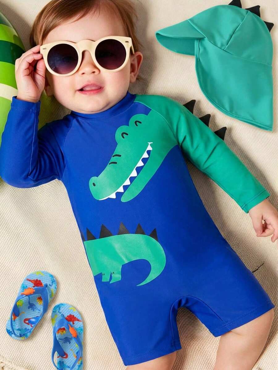 SHEIN Bubblio Bộ 2 món đồ bơi dài tay họa tiết khủng long và cá sấu dễ thương cho bé trai và bé gái đi nghỉ mát thường ngày kèm mũ chống nắng, thích hợp cho mùa xuân, mùa hè, mùa thu, mùa đông khi bơi lội, lướt sóng, chống nắng, đi nghỉ, đi biển, suối nước nóng