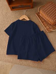 SHEIN LMoss Kids Bộ đồ 2 mảnh gồm áo sơ mi ngắn tay và quần short họa tiết da báo, kiểu dáng tối giản, thích hợp cho bé gái tuổi teen, kèm nơ cổ vintage và họa tiết da báo, phù hợp cho mùa hè. - Màu xanh hải quân - Xem 2