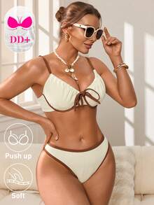 Swim DD+ 这款新款加大码（DD+）支撑提拉比基尼套装专为女性设计，采用奶油色双色纹理面料，搭配棕色撞色滚边和前蝴蝶结装饰，配有带衬垫的软杯文胸，提供最大程度的提拉效果和舒适感，高腰三角裤设计，完美贴合曲线身材，适合海滩、泳池派对、热带度假和度假村等场合。速干弹力面料，是追求时尚、支撑和自信的DD+罩杯女性的理想之选。 - 白色 - 查看 9