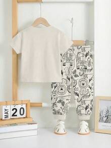 SHEIN 2 pièces/Set T-shirt à manches courtes ample et confortable et pantalon pour bébé garçon, convient pour le printemps/été. Imprimés mignons et classiques d'animaux de la bande dessinée comme zèbre, tigre, ours brun, lion, écureuil, hippopotame, éléphant - Multicolore - Voir 5