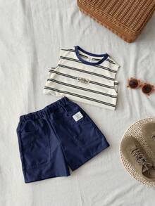 SHEIN Set de 2 piezas de top sin mangas con estampado de rayas y shorts de unicolor, casual y cómodo para niños pequeños - Azul Marino - Ver 7