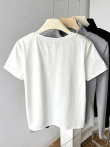 SHEIN Áo thun dệt kim màu trắng dáng rộng cổ tròn họa tiết trái tim đính hạt cườm thanh lịch đa năng thoải mái cho bé gái tuổi teen, thích hợp cho mùa xuân/hè. - trắng - Xem 2