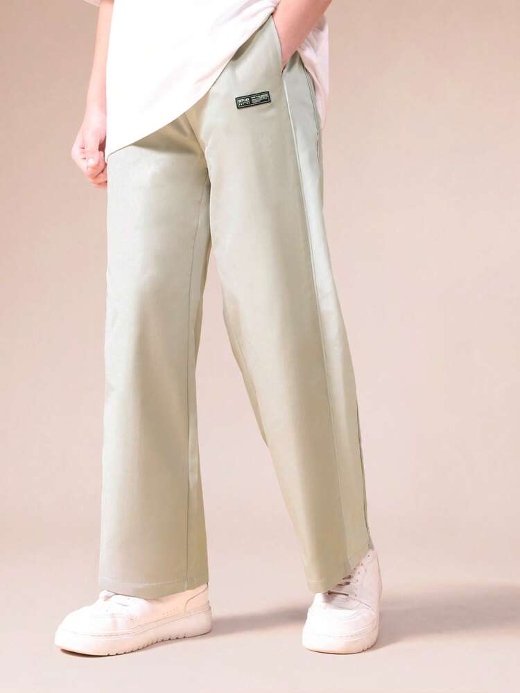 Pantalon de survêtement ample à jambes larges avec bande de propreté latérale