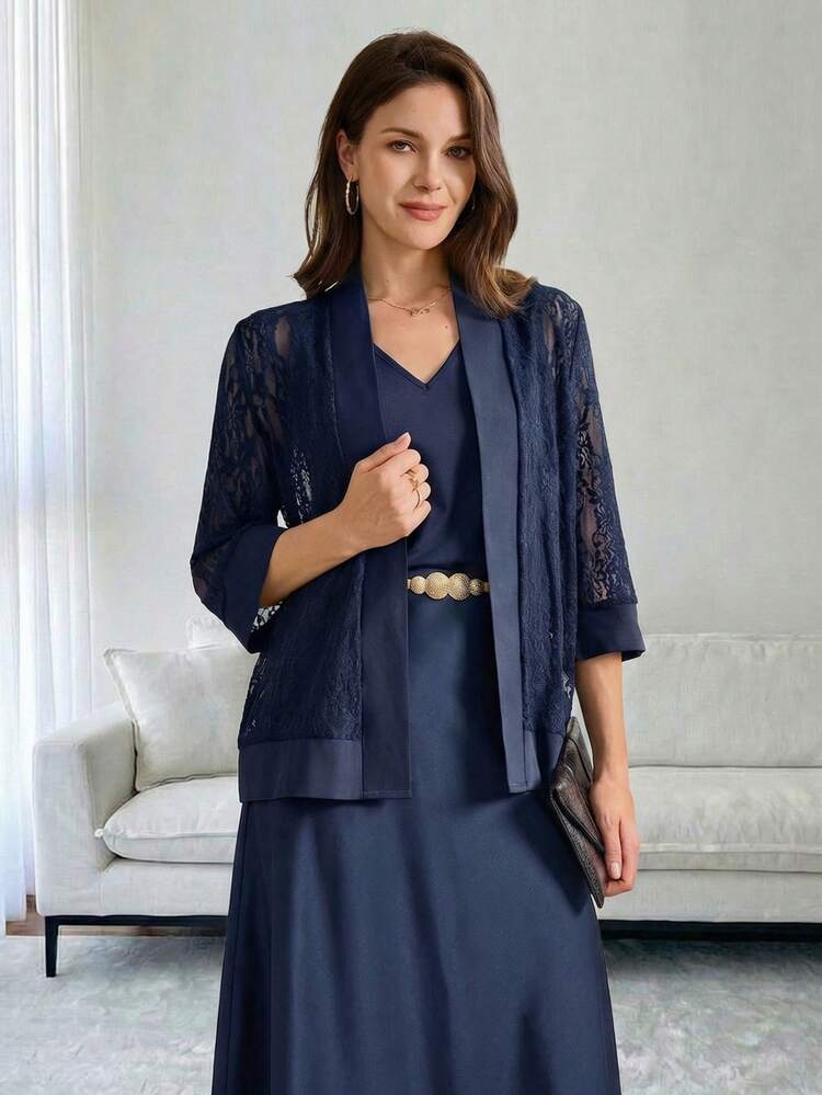 This Elegant Two-Piece Women's Set Features A Deep Navy Blue Base, With The Combination Of Lace Texture And Matte Fabric Exuding A Touch Of Understated Luxury. The Floral Pattern Is A Delicate, Subtle Lace Design, Revealing A Gentle And Refined Temperament In Its Understated Details. The Silhouette Consists Of A Loose-Fitting Lace Cardigan And A Fitted V-Neck Vest. The Lightweight Fabric Is Versatile Enough For Various Occasions, And The Layering Design Balances Warmth And Style.Suitable For Spring And Autumn, And Suitable For Commuting, Casual Gatherings, Or Relaxing Afternoon Tea, This Set Conveys A Composed Style With Its Navy Blue Base And Showcases Elegant Fashion Sense With Its Lace Details. It's A Versatile And Stylish Choice For Any Two-Season Wardrobe.