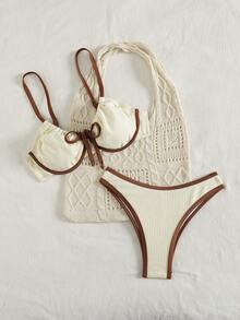 Swim DD+ 这款新款加大码（DD+）支撑提拉比基尼套装专为女性设计，采用奶油色双色纹理面料，搭配棕色撞色滚边和前蝴蝶结装饰，配有带衬垫的软杯文胸，提供最大程度的提拉效果和舒适感，高腰三角裤设计，完美贴合曲线身材，适合海滩、泳池派对、热带度假和度假村等场合。速干弹力面料，是追求时尚、支撑和自信的DD+罩杯女性的理想之选。 - 白色 - 查看 4