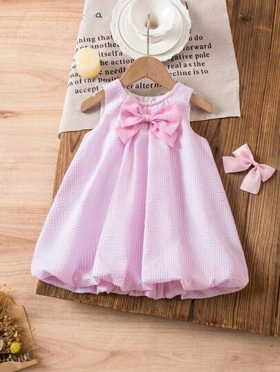 SHEIN This Single-Piece Cute Baby Girl Casual, Simple, And Adorable Pink And White Striped Sleeveless Dress With A Large Bow Is Suitable For Birthday Parties, Evening Parties, Performances, Weddings, Baptisms, Opening Ceremonies, Everyday Wear, School, Outings, And Spring/Summer Seasons.