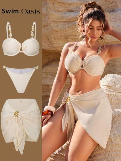 Swim Oasis 大码三件套泳衣：米色钢圈支撑上衣，饰有石链，侧边系带可调节泳裤，以及向日葵印花裙，适合夏季海滩度假