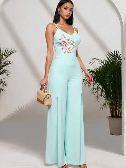 INAWLY Mint Green Embroidered Jumpsuit With V-Neck Straps, Hand-Painted Floral Embroidery On Chest For Elegant Look, Flowing Wide-Leg Pants Design For Refreshing Comfort, High-Waisted Wide-Leg Pants Elongate And Flatter The Figure, Intricate Embroidered Chest Pattern, Effortlessly Chic And Luxurious