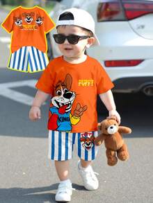 SHEIN 2 piezas Conjunto de camiseta casual y pantalones a rayas para niño, camiseta con estampado de perrito lindo, pantalones con patrón a rayas azul y blanco, adecuado para el verano - Multicolor - Ver 1