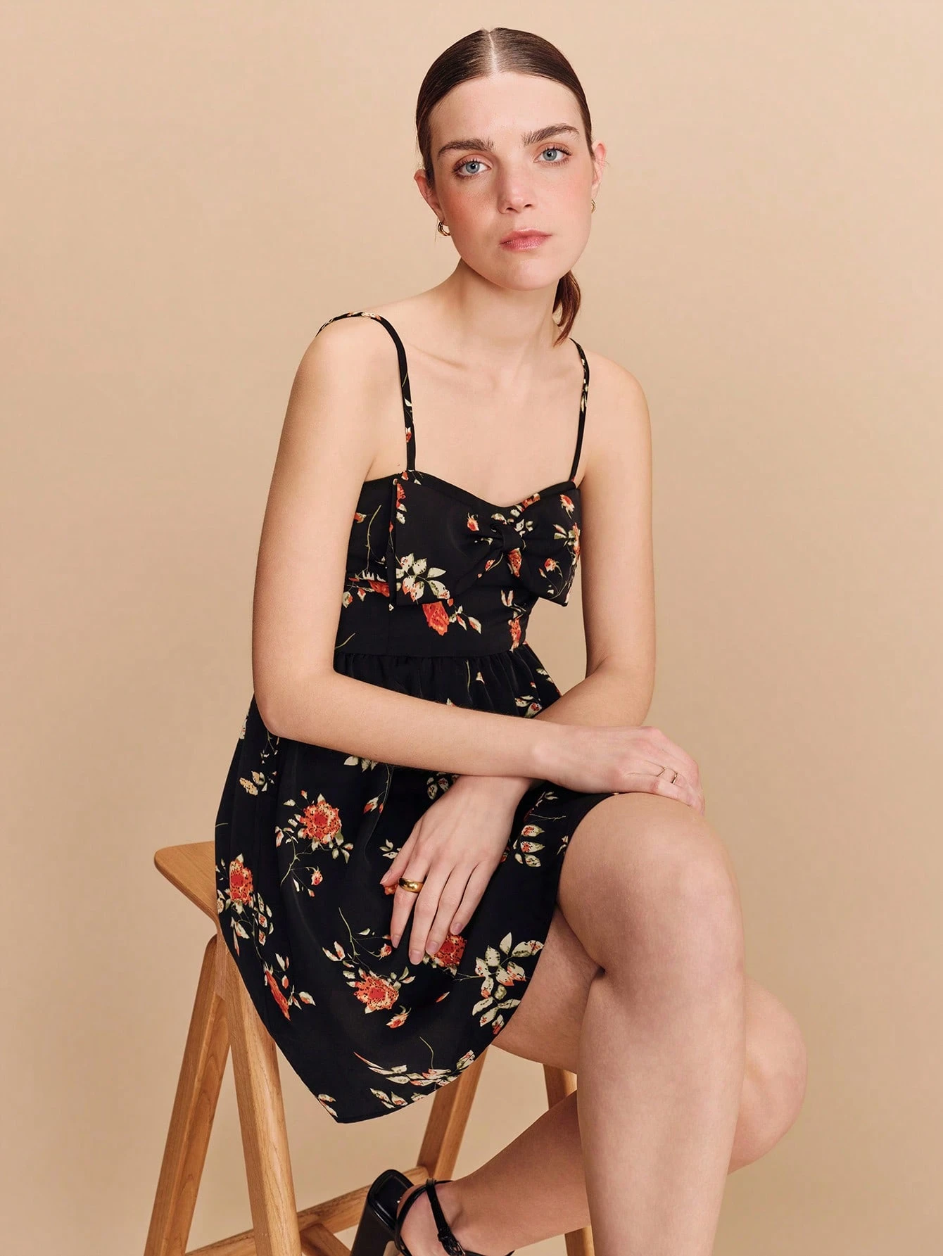 Black Floral Print Fitted Mini Dress With Oversized Front Bow Delicate Straps And Flared Hem Cute Vintage Spring Summer Dress French Style Parisian Style Vacation Outfit
