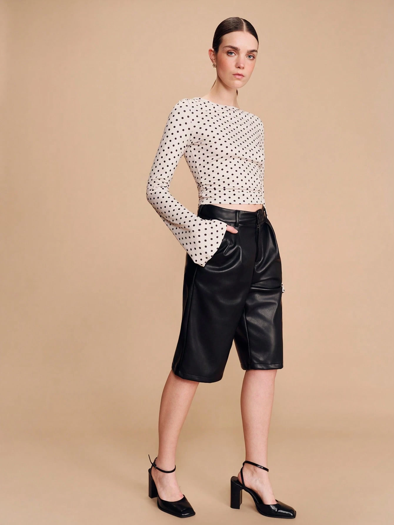 Black Faux Leather High Waisted Bermuda Shorts With Tailored Pleats And Relaxed Fit Chic Modern Spring Summer Bottom French Style Parisian Style
