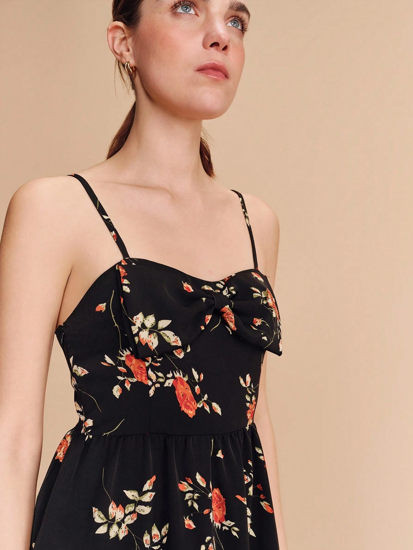 Black Floral Print Fitted Mini Dress With Oversized Front Bow Delicate Straps And Flared Hem Cute Vintage Spring Summer Dress French Style Parisian Style Vacation Outfit