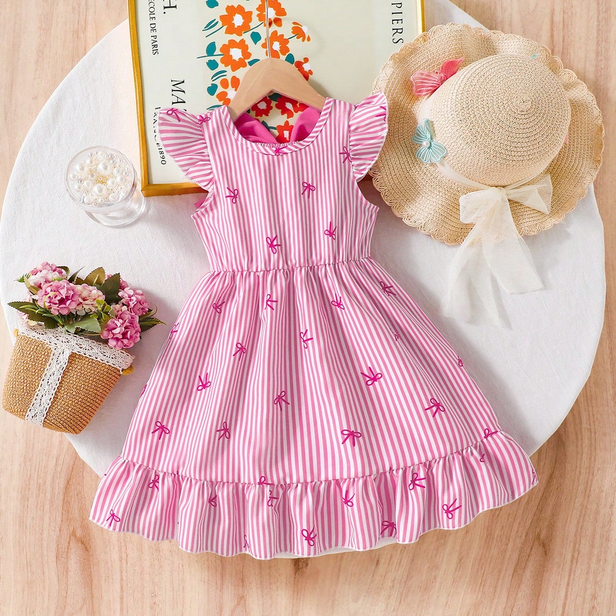 Vestido casual y elegante para niñas con estampado de rayas y lazos, cuello redondo, mangas de vuelo, espalda hueca, decoración de lazo en la cintur