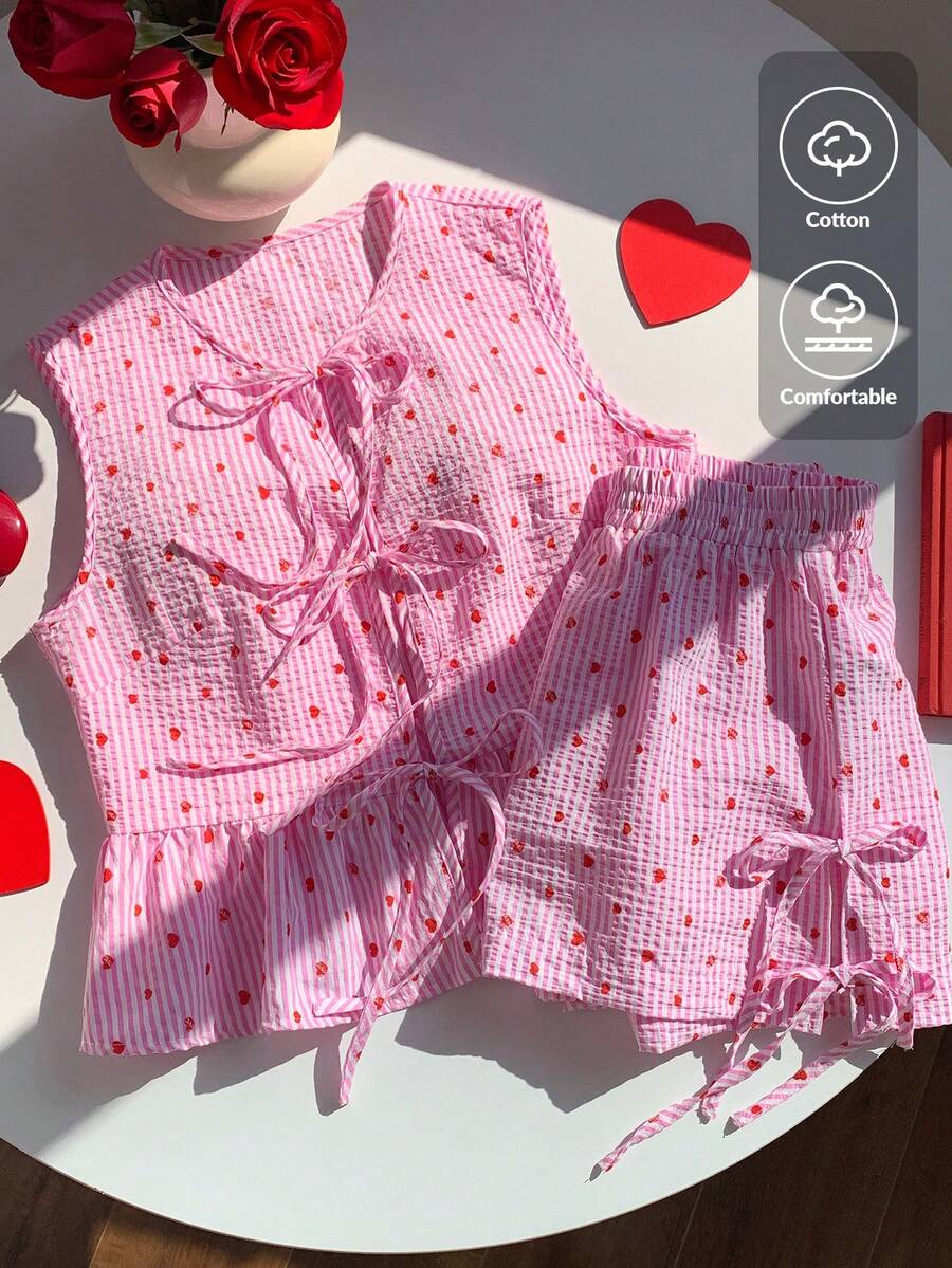 Comfortcana Bộ đồ nữ thời trang mới năm 2026 gồm áo hai dây và quần short cotton kẻ sọc in hình trái tim, kiểu dáng thường ngày, buộc dây phía trước, thích hợp mặc nhà vào mùa hè, xuân, ngày lễ tình nhân, màu hồng. Bộ hai mảnh màu hồng, quần short màu hồng, bộ đồ ngủ màu hồng, quần short in hình trái tim, áo và quần short kẻ sọc, bộ đồ mặc nhà dễ thương, áo kiểu màu hồng, thanh lịch, thích hợp cho kỳ nghỉ, thường ngày, phong cách Y2K, quần áo mùa hè, xuân, ngày lễ tình nhân, trang phục lễ hội, bãi biển, tiệc sinh nhật, đám cưới, trang phục đi chơi cho nữ, áo không tay và quần short, bộ quần short in hình trái tim, bộ in hình trái tim, bộ quần short kẻ sọc, bộ quần short nữ. - Đỏ - Xem 1