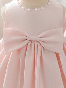 SHEIN Glamorique Kids Abito da damigella d'onore per bambina con tessuto morbido e lucido rosa, fiocco grande, strascico con ricamo a mano con perline. Adatto come abito per il primo compleanno della bambina e perfetto per la primavera e l'estate. Ideale per balli di laurea, eventi serali formali e outfit da festa. Abito rosa con fiocco per bambina, abiti eleganti per bambina con fiocco grande, abito rosa per bambina - Rosa - Visualizzare 6