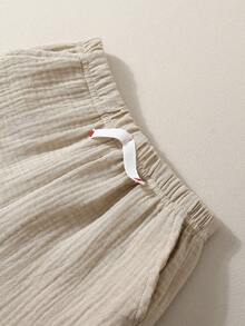 男婴休闲双层纱布短裤，带口袋和松紧腰带，装饰绳设计，百搭风格，适合日常穿着、上学、旅行、运动——婴儿/幼儿短裤、新生儿短裤、夏季婴儿短裤、婴儿裤、带口袋男婴短裤、男女通用短裤、婴儿度假短裤 - 卡其色 - 查看 6