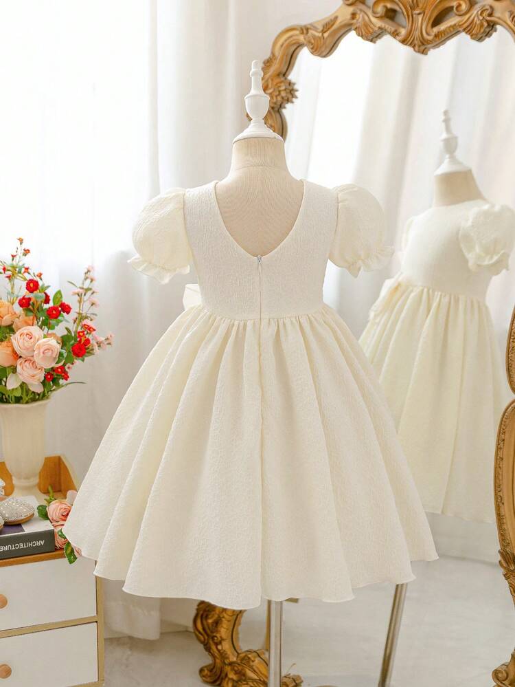 Glamorique Kids 少女优雅简约杏色提花面料泡泡袖公主裙，正面饰有雪纺蝴蝶结，适合表演、生日、派对等场合，四季皆宜。 - 杏色 - 查看 2