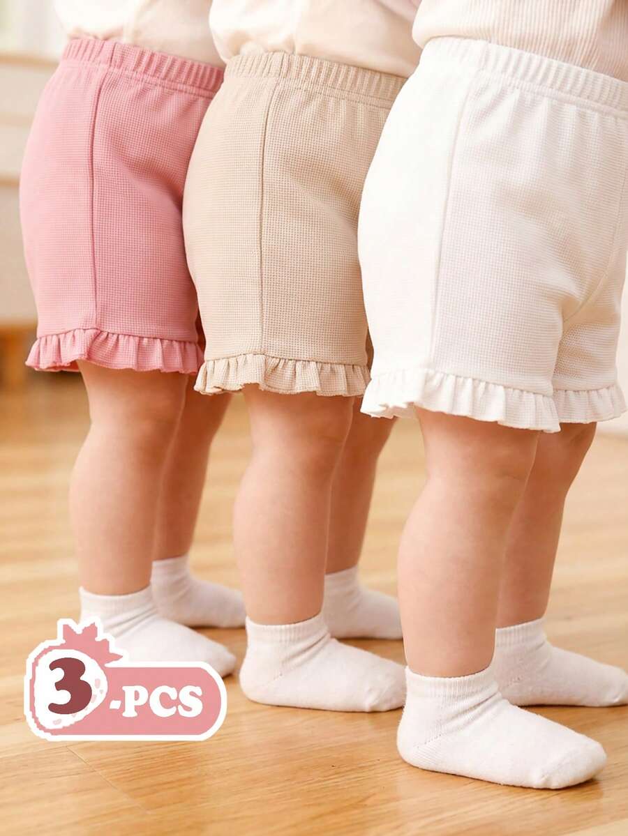 SHEIN Vintaside Kids 3件套婴幼儿女童休闲宽松舒适短裤套装，柔软透气镂空针织面料，弹性腰带配荷叶边，粉色和白色纯色，多种颜色可选，性价比高，适合春夏居家/外出/度假穿着。 - 米色 - 查看 1