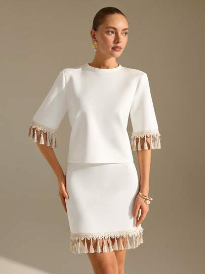 CLARA VERO White High Waist Tassel Trim Mini Skirt: Slim Fit And Playful Hem Detail, Ideal For Summer Parties Or Beach Club Events, Crafted In Non-Elastic Polyester Featuring Delicate Fringe Tassel And Streamlined Silhouette White Skirt And Top Set Fringe Tops For Women White Fringe Dress Off White Dresses For Women Tassel Dress White Outfits For Women Party Fringe Skirt Tassel Top White Short Skirt White Fringe Set White Set Skirt And Top Fringe Skirt And Top White Outfit For Women For Party Tassel Skirt Fringe Top And Skirt White Short Skirt Outfit