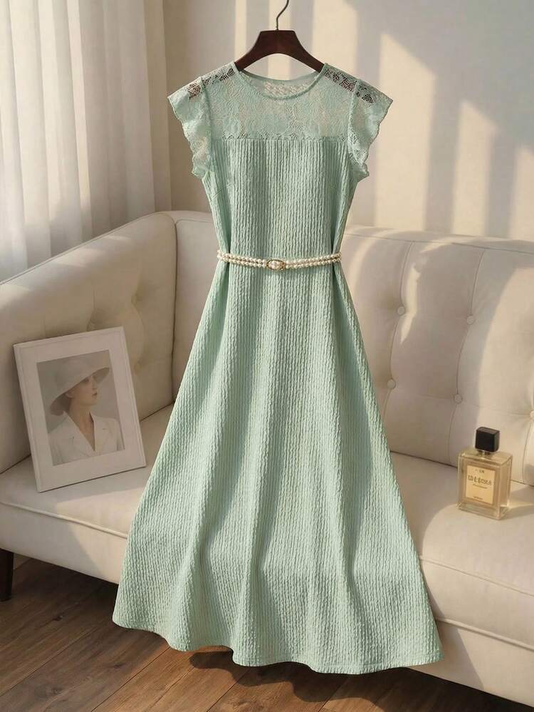 This Elegant Summer Dress For Women Features A Refreshing Mint Green Color. Its Soft Texture Exudes A Soothing Atmosphere, Providing A Gentle Base For Any Stylish Look. The Floral Pattern Combines Lace Trim With Textured Fabric, Showcasing Delicate Details And A Refined Sense Of Fashion. The Design Includes A Round Neck, Short Flutter Sleeves, A Fitted Waist, And A Full Skirt. A Pearl Belt Accentuates The Figure, While The Flowing Skirt Adds An Elegant Touch. Suitable For Spring And Autumn, It Can Be Paired With Light-Colored Accessories To Brighten The Look Or Layered With A Cardigan For Added Femininity. Perfect For Casual Gatherings Or Everyday Outings, This Dress Combines The Refreshing Mint Green With Sophisticated Lace Details, Making It A Versatile Wardrobe Staple That Blends Femininity And Practicality.