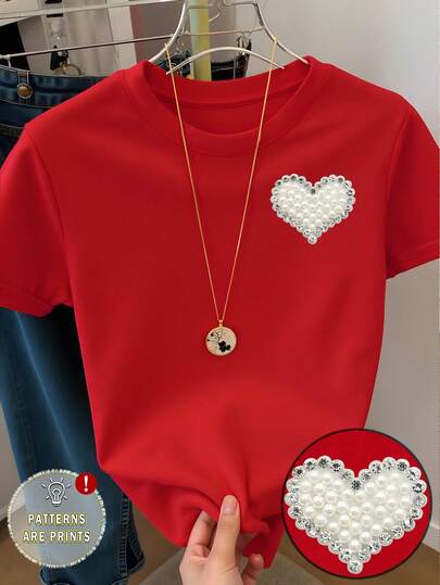 1 pieza Camiseta gráfica con corazón de perla y rhinestone, estilo casual y elegante para niñas, cómoda camiseta básica de manga corta, adecuada para primavera, verano, otoño, atuendo del Día de San Valentín