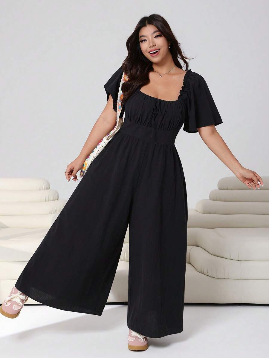 SHEIN EZwear 2026春夏新款休闲日常穿搭，适合派对、约会、生日、音乐节、返校、通勤、度假等多种场合。荷叶边短袖连体裤，露肩设计，柔软棉混纺面料，宽松版型，长款，黑色，大码可选。 - 黑色 - 查看 1
