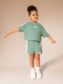 SUMWON Bộ đồ thể thao Future Icon gồm áo thun ngắn tay dáng lửng và quần short, phối cùng sọc hồng tương phản ở hai bên, thích hợp mặc thường ngày vào mùa xuân hè. - màu xanh lá - Xem 7