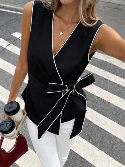 Pariaura Women's Commuter Black Sleeveless Vest Jacket, Contrast White Trim, Black V-Neck Vest With Adjustable Waist Tie, Crisp Fabric, Streamlined Tailoring, V-Neck And White Accents Create A Minimalist, Powerful Look. Adjustable Waist Tie Easily Shapes The Golden Ratio, Polished, Chic, Elegant, Stylish Commuter Piece Suitable For Casual, Office, Meeting, Party, Date, Vacation Black Sleeveless Top Bow Top Women Black Wrap Top Black Vest Women Elegant Black Top Black And White Wrap Top Wrap Tops For Women Black And White Blouse Business Casual Tops Woman Black And White Top