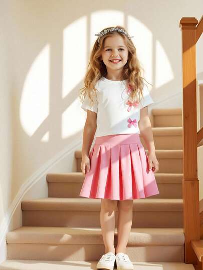 SHEIN مجموعة ملابس يومية كاجوال للبنات، تي شيرت مزين بفيونكة وتنورة مطوية مزينة بفيونكة، مناسبة للخروجات والاستخدام اليومي