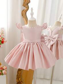 Glamorique Kids 这款女童粉色缎面连衣裙，光泽亮丽，后背饰有大蝴蝶结，并点缀着手工串珠。适合夏季度假、公主主题活动、毕业舞会、演出、宴会和派对等场合。这款春季连衣裙也完美适用于宝宝生日、婚礼花童和其他特殊场合。 - 粉色 - 查看 2