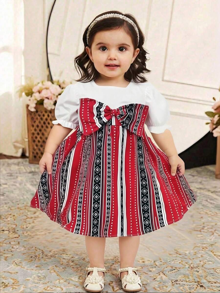 Đầm mùa hè kiểu dáng thường ngày cho bé gái, cổ vuông, tay phồng, trang trí nơ, họa tiết hình học phối hợp, thắt eo. - Đỏ - Xem 1