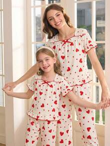 女童两件套睡衣：短袖上衣，饰有蝴蝶结和爱心印花，荷叶边下摆；宽松长裤，荷叶边下摆。 - 杏色 - 查看 12