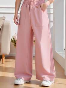 SHEIN Genkimix Kids Quần ống rộng dáng suông cho bé gái, màu hồng nhạt, thiết kế tối giản và nhẹ nhàng, cạp chun co giãn + túi tiện dụng, kiểu dáng mềm mại phù hợp cho hoạt động thể thao. Thích hợp cho các dịp xuân/thu như đi học, đi chơi, họp mặt gia đình, phong cách Hàn Quốc nhẹ nhàng. - Hồng - Xem 1