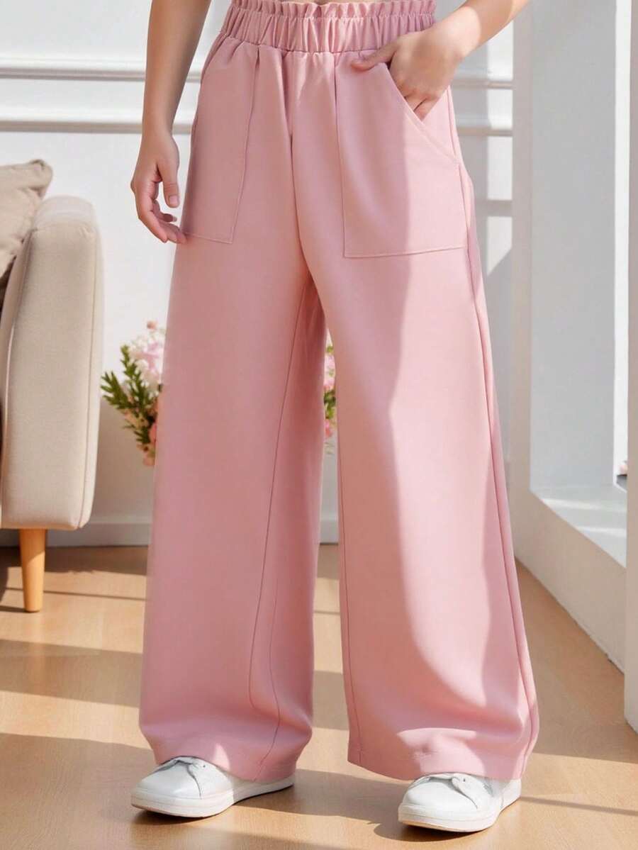 SHEIN Genkimix Kids Quần ống rộng dáng suông cho bé gái, màu hồng nhạt, thiết kế tối giản và nhẹ nhàng, cạp chun co giãn + túi tiện dụng, kiểu dáng mềm mại phù hợp cho hoạt động thể thao. Thích hợp cho các dịp xuân/thu như đi học, đi chơi, họp mặt gia đình, phong cách Hàn Quốc nhẹ nhàng. - Hồng - Xem 1