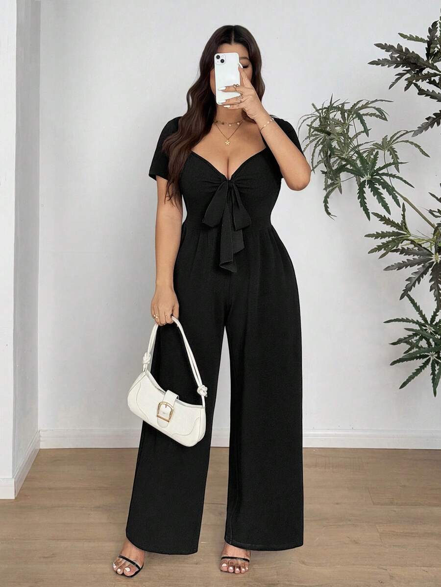 Vionelle Bộ jumpsuit nữ cỡ lớn màu trơn, tay ngắn, cổ chữ V, buộc dây phía trước, ống rộng. - màu đen - Xem 1