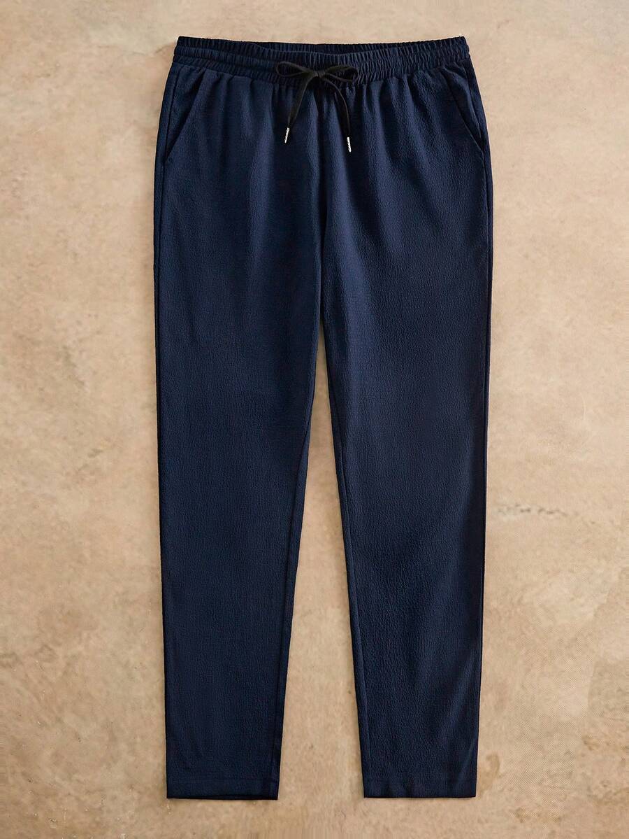 HIMLAND Quần dài nam màu trơn dệt kim, cạp chun, có túi