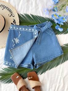 Soleia Women's Floral Print Wrap Tie Casual Denim Mini Skort Women's Mid-Blue Denim Skort With White Floral Embroidery And Bow Side Detail Summer Casual A-Line Mini Skort Summer Outfits Summer Outfits For Women Spring Clothing Spring Break Outfits Summer Holiday Outfits Summer Vacation Outfits Beach Vacation Outfits For Women Casual Outfit For Women  Floral Skort Blue Skort - Medium Wash - View 3